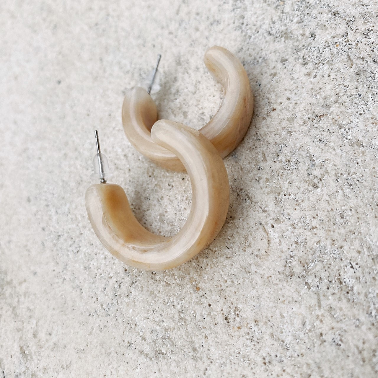 Marble stone half hoop pierces.